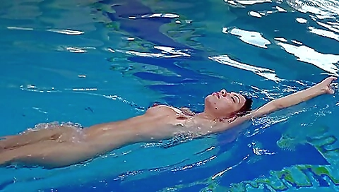 Beautiful brunette naked in the sea with a wet pussy