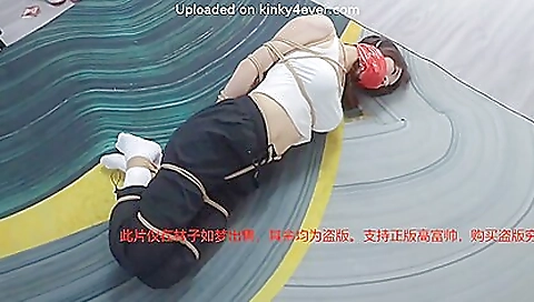 Busty asian brunette plays with a big dick in fetish video