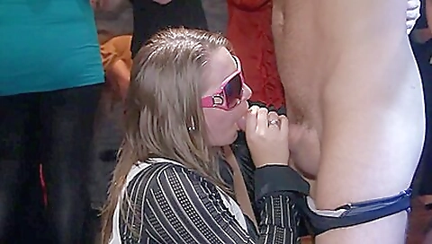 Bright blonde brunette in a dress plays with her boyfriend