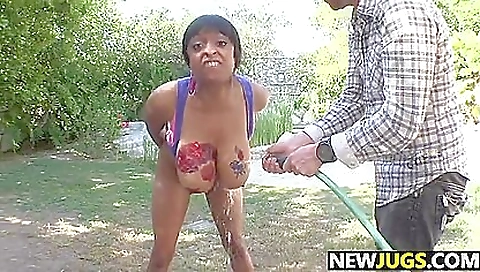 Ebony babe rides her friend's cock in the backyard